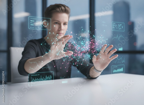 Young Business Woman Manipulating Colorful Holographic Digital Data. Futuristic Virtual Interface Concept.