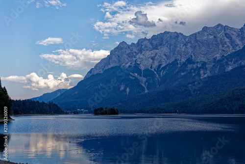Turquoise Waters and Islands of Lake Eibsee Beneath Zugspitze Mountain Peak