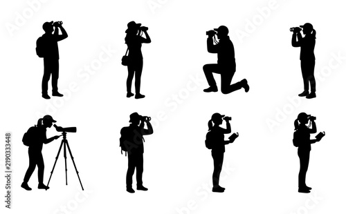 Silhouettes of people looking through binoculars and telescope
