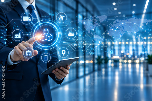 Businessman interacting with illuminated icons representing logistics and global connectivity