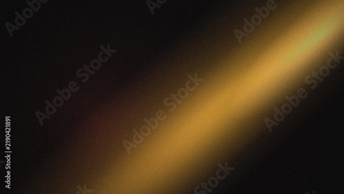 Quadro su tela Golden light streak with blurred edges against a dark background