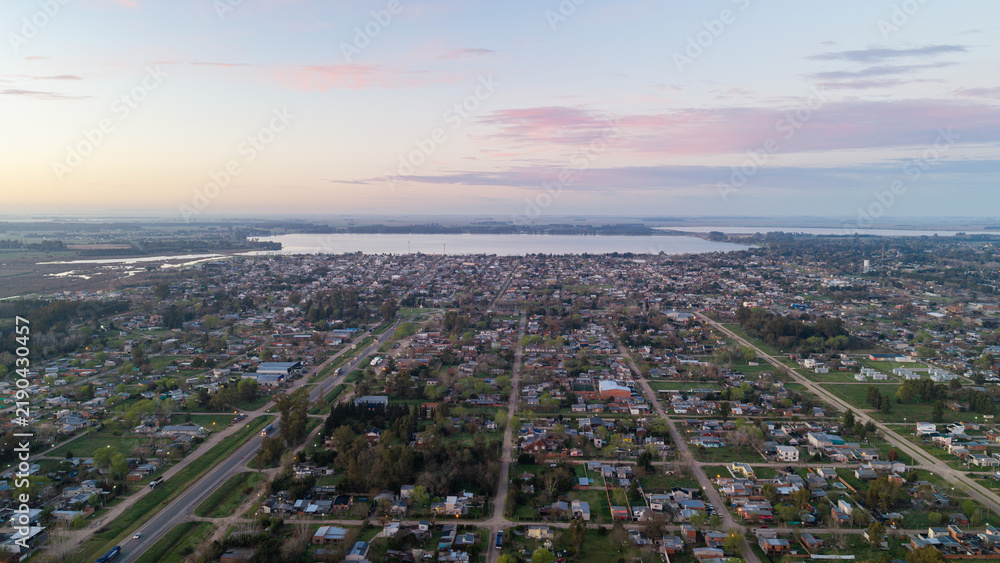 Obraz premium Pastel dawn sky over San Miguel del Monte and Laguna de Monte, Argentina.