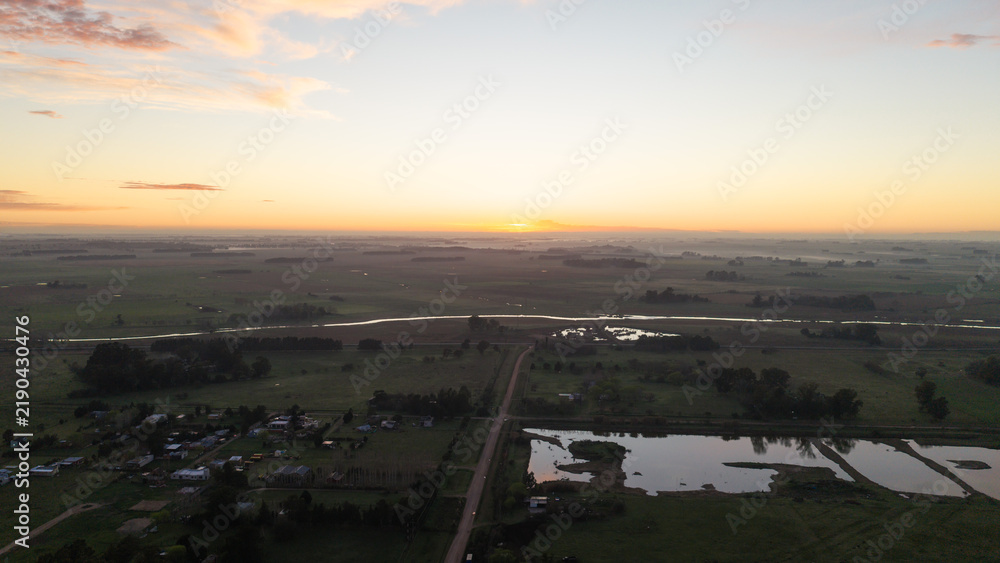Obraz premium Sunrise over the rural outskirts of San Miguel del Monte, Buenos Aires province, Argentina.