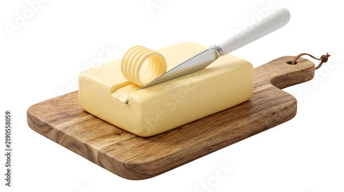 Fresh yellow butter block on wooden cutting board, creamy butter curl with silver knife, organic dairy product for baking and cooking
