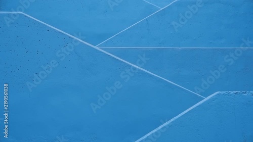 Elegant woman going down the blue stairs 