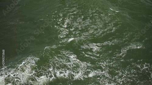 Sea waves seen from the ship's deck. From a ferry in the Baltic Sea at the end of summer