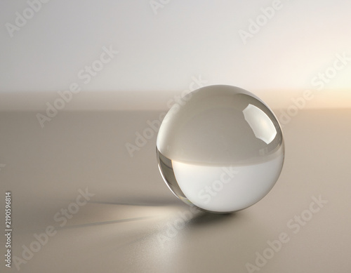 Minimalist Transparent Glass Sphere Resting on a Smooth Surface with Soft Studio Lighting