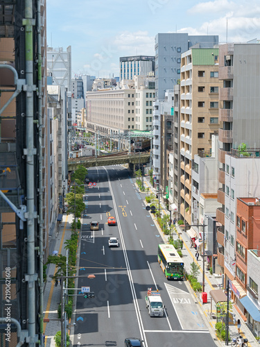 Green Bus on an Urban Street in Asakusa Tokyo