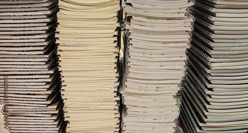 Foto Pile of school notebooks on shelf