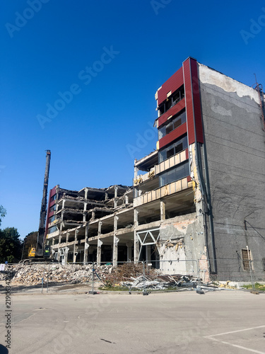 An old concrete building is being demolished to make way for a new, modern one. Riga, Latvia
