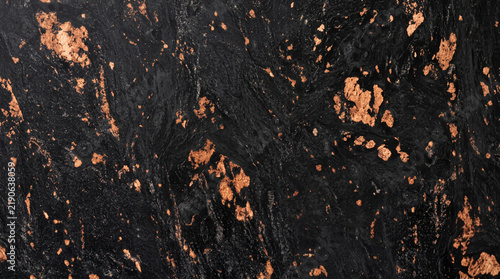 Honed Black Fusion granite texture with vibrant copper bronze nuggets, terracotta amber flecks, and deep obsidian black matrix, ideal for luxury 3D dark interior material mapping, executive product 