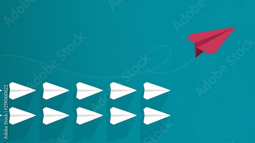 A red paper airplane flying away from a group of white paper airplanes on a teal background, symbolizing leadership, innovation, and standing out