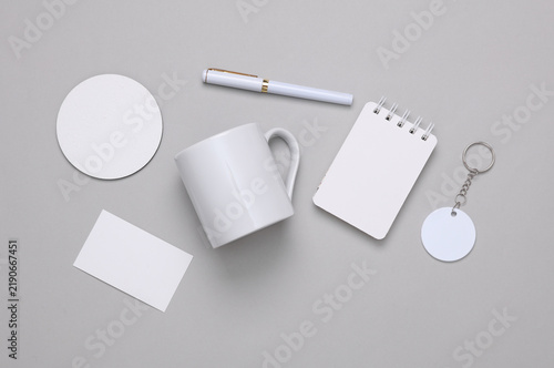 Corporate identity, set of white blank promotional products for business on a gray background. Flat lay. Creative mockup for your brand design.