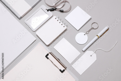 Corporate identity, set of white blank promotional products for business on a gray background. Flat lay. Creative mockup for your brand design.