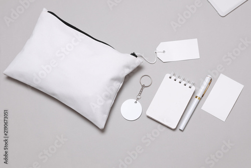 Corporate identity, set of white blank promotional products for business on a gray background. Flat lay. Creative mockup for your brand design.