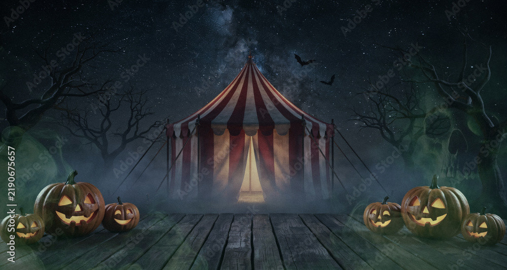 Obraz premium Halloween Night Background with Creepy Circus Tent, Starry Night Sky, Milky Way, Bare Trees, Flying Bats and Glowing Jack O Lantern Pumpkins on Wooden Path for Halloween Party Banner, Poster