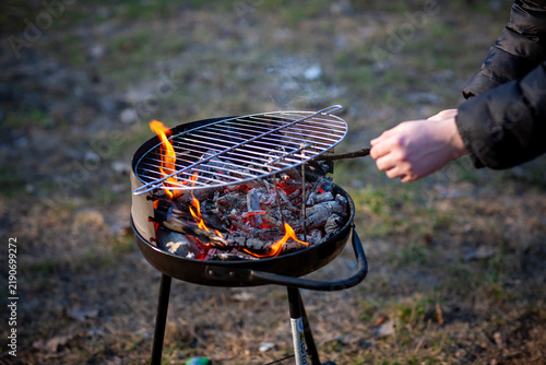 Quadro su tela Hot, slightly mystical and mysterious corners of the barbecue on the street attract attention, in some places tongues of fire break out