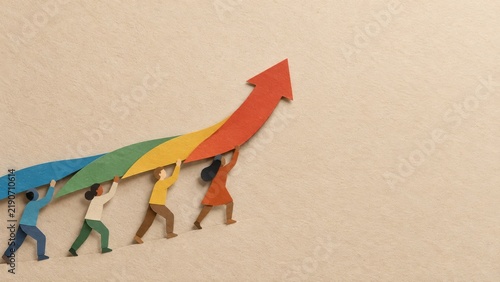Colored paper strips joining into an upward path