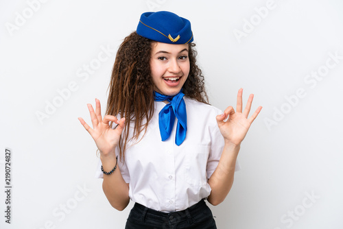 Foto Airplane stewardess Arab woman isolated on white background showing an ok sign w