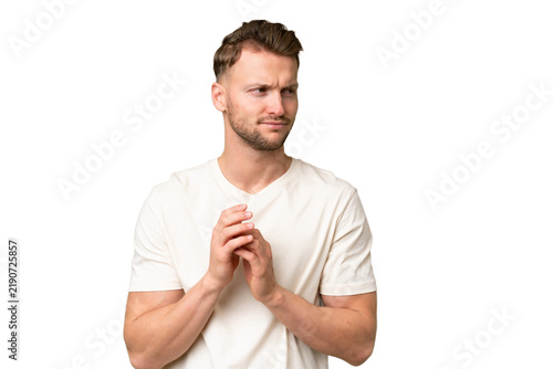 Fotografía Young blonde caucasian man over isolated background scheming something