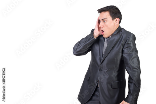 Obraz na płótnie Shocked male in formal wear touching face and looking aside with opened mouth