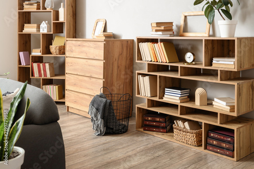 Chest of drawers and bookcases in interior of living room
