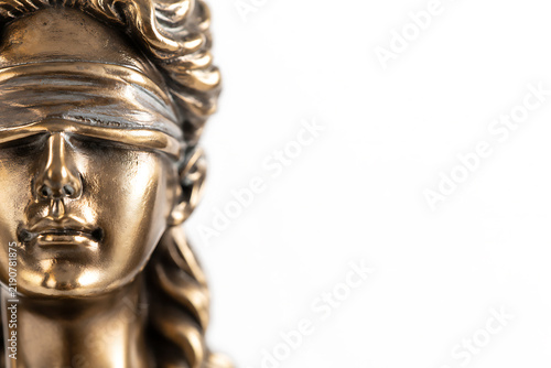 Bronze statue of lady justice with blindfold close up on face and hair