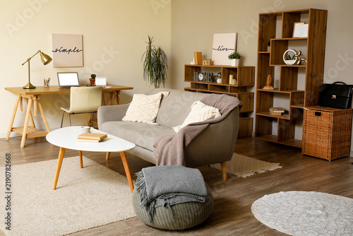 Interior of living room with sofa and modern workplace