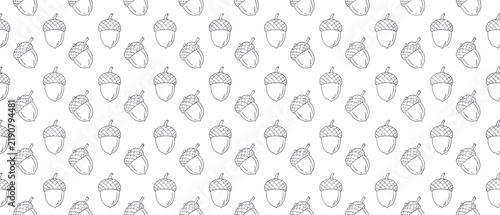 Seamless outline pattern of acorns with caps on a white background