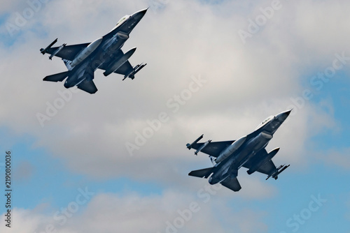 F16 fighter jets isolated against a blue sky
