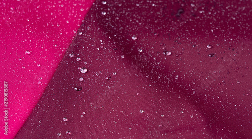 Fotografie Waterproof fabric texture with rain drops closeup