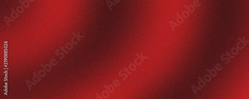 Deep red velvet texture with soft shadows. Elegant crimson fabric background with smooth silk waves. Luxurious maroon textile surface for holiday cards. Dark ruby satin drape for backdrop.