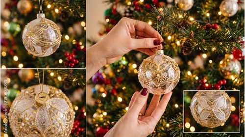 Close up of a woman's hands decorating a Christmas tree with a clear ornate bauble