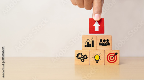 Business development strategy and action plan concept on wooden blocks