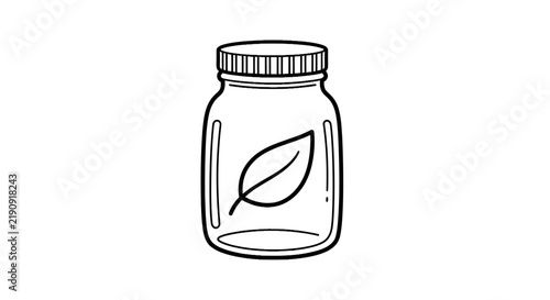 Glass jar with leaf inside.