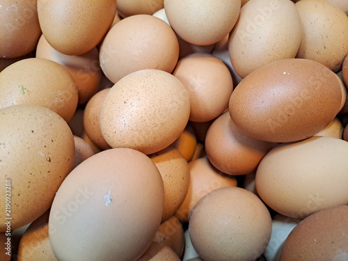 Fresh organic chicken eggs background close up top view