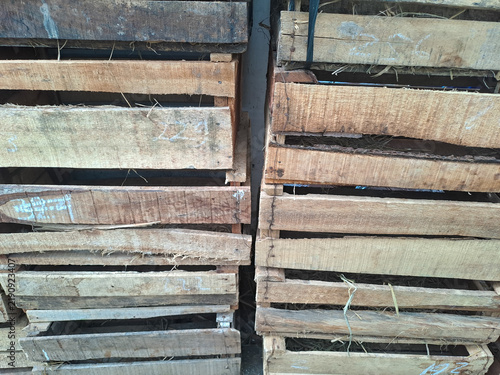 Stack of old wooden boxes and crates texture background	