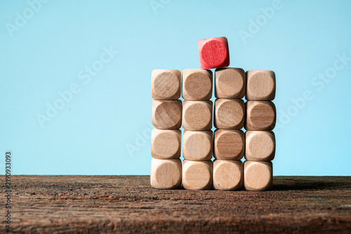 Plakat Wooden Blocks Stacked in a Unique Pattern on a Rustic Surface