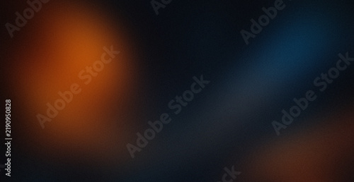 Abstract dark background with soft glowing orange and blue light leaks and grainy film texture