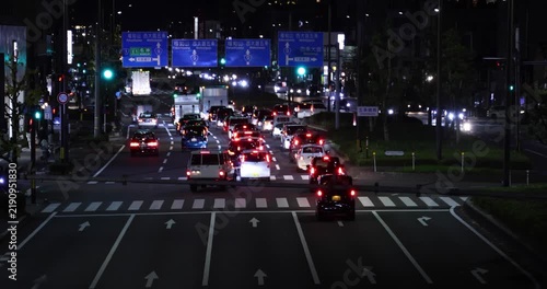 A night cityscape of traffic jam at the urban street in Kyoto in winter telephoto