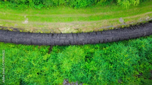 Summer aerial view featuring the 3.4 mile long wooden penstock in Vermont known as The Snake that runs from the Searsburg Dam to a generating station along the Deerfield River with an 8 foot diameter