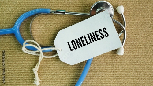 Bild auf Leinwand Stethoscope and paper tag with the word Loneliness