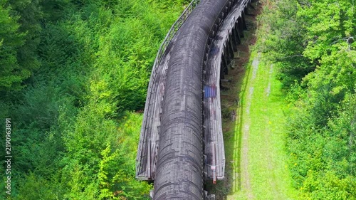 Summer aerial view featuring the 3.4 mile long wooden penstock in Vermont known as The Snake that runs from the Searsburg Dam to a generating station along the Deerfield River with an 8 foot diameter