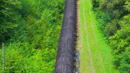 Summer aerial view featuring the 3.4 mile long wooden penstock in Vermont known as The Snake that runs from the Searsburg Dam to a generating station along the Deerfield River with an 8 foot diameter