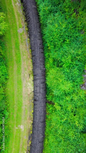 Summer aerial view featuring the 3.4 mile long wooden penstock in Vermont known as The Snake that runs from the Searsburg Dam to a generating station along the Deerfield River with an 8 foot diameter