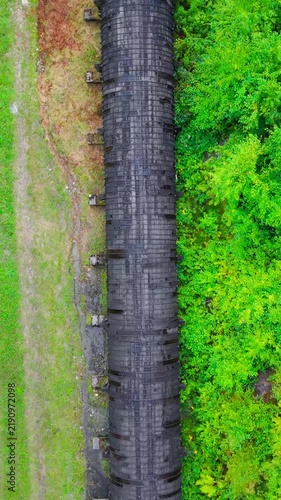 Summer aerial view featuring the 3.4 mile long wooden penstock in Vermont known as The Snake that runs from the Searsburg Dam to a generating station along the Deerfield River with an 8 foot diameter