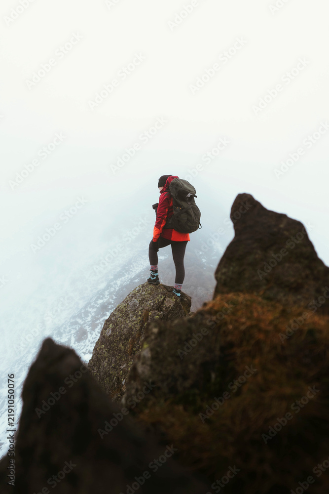 Obraz premium Hiker at Helvellyn summit in the English Lake District, England