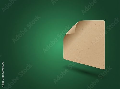 Blank brown paper sticker with a curled corner on green
