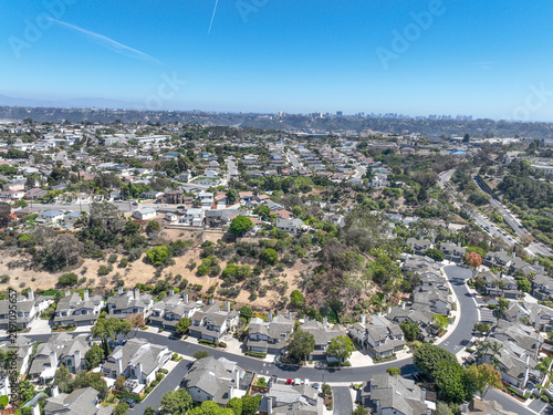 Aerial view of San Diego, Linda Vista neighborhood with houses and street during sunny day, California, USA.
