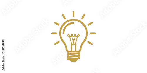 Golden lightbulb idea icon with rays symbolizing creativity energy.